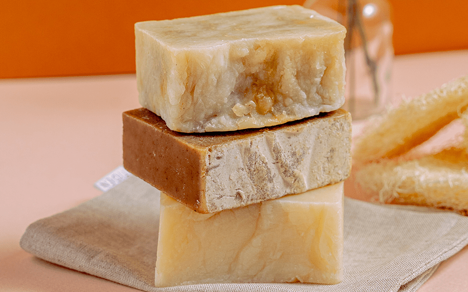 Three different types of soap stacked on top of each other.